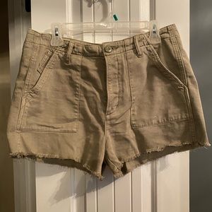 Army green shorts.